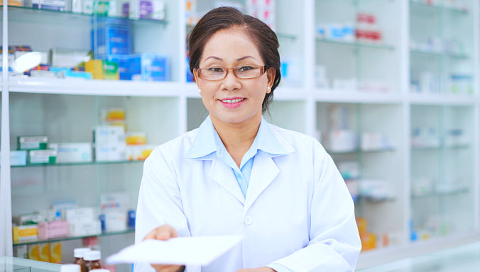 beautiful pharmacist with eyeglasses smiling